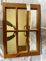 Front view of the mirror showing its 6 pane construction and pine wood frame.