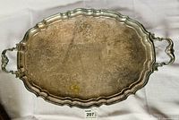 Top view of the large Birks Regency silverplated butler tray showing ornate decorative engraved patterns and scalloped edges with handles.