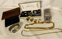 Overview of the full set with jewelry box, rings, cufflinks, watch, necklace, and chain bracelet