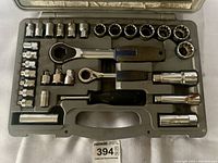 Top-down view of socket set with sockets, ratchets, extensions in molded case