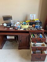 Full desk top with all items showing Epson printer, various office supplies in trays, drawers with pens, cords and small tools.