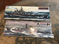 Top view of two Tamiya kit boxes: Missouri (top) and Yamato (bottom).