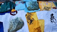 Overview of ten apparel pieces including hoodies, sweatshirts and t-shirts, showing various animal prints and solid colors