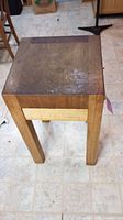 Front view of butcher block showing top surface wear and overall structure