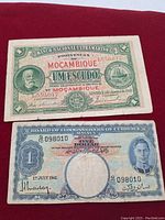 Front side of Mozambique and Malaya bank notes showing dates, denominations, and portraits.