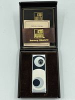 Vintage Good Luck Guardian Hex battery electric lighter in original case with instruction manual visible.