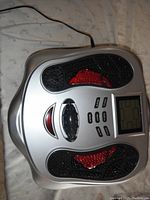 Top-down view of AST-300D main unit on fabric background