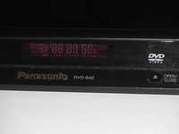 Close-up of the front panel of the Panasonic DVD/CD player showing model number, brand, and display with numerical readout.