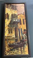 Photo of the vertical oil painting of a gondola on a Venetian canal with historic buildings