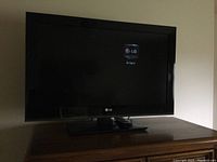 LG 32LK450 TV turned on with 'No Signal' message displayed on screen.