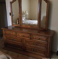 Full view of dresser and attached tri-fold mirror