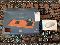 Microsoft Modern Mouse and General Supply Wireless Charging Mouse Pad side by side in boxes