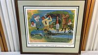 Full view of the framed golf legends poster featuring several golfers and a scenic golf course background.