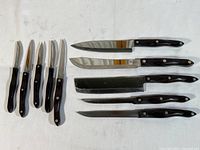 Overview of 11 Cutco knives on white background