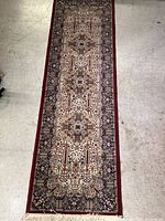Full view of wool medium size runner rug showing length, width and pattern details.