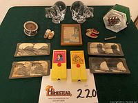 Photo showing the entire lot with all items arranged on a green cloth.