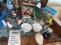 Photo showing overall lot with porcelain, ceramic, glass figurines, and tea set.