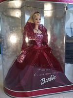 Doll in original box showing full body and holiday outfit.