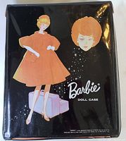 Exterior of black vinyl Barbie doll case with stylized blonde illustration