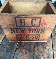 Top front view of the wooden crate showing BC, New York, Michigan stamps and code 1650.