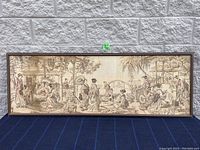 Full view of the large vintage tapestry framed, showing an Asian style outdoor scene with multiple figures, natural and architectural elements.