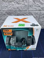 Front view of Logitech X-540 speaker system box showing 5.1 speakers and wattage details.