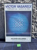 Full view of the framed Victor Vasarely exhibition poster, showing the design and text clearly.