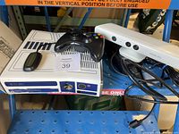 Xbox 360 console with R2-D2 themed design, black wireless controller on top, and white Kinect sensor
