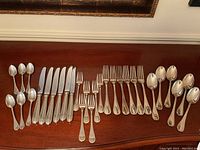 Full layout of all 30 pieces on wood surface