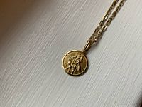 Close-up of medal front showing St. Christopher relief