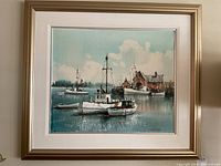 Full view of framed painting depicting boats in harbor, showing the overall scene and frame.