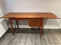 Full frontal view of desk with drop-down extension opened