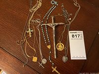 Overview of all religious jewelry items including rosaries, crucifixes, medals, pendants and chains