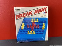 Original sealed box of Gabriel Hi-Q Break Away game showing front of box with game board and pieces illustration.