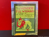 Front cover of the sealed hardcover book showing the title and lion illustration close-up