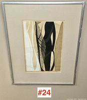 Full front view of framed print against wall