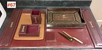 Overall view of the vintage desk accessories showing the set's various leather pieces including the letter tray, pen box, pencil cup, and desk pad.