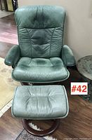 Front view of chair and ottoman showing overall pairing and condition