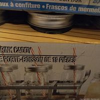 Close-up of box showing 19-piece drink caddy with jars and straws
