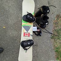 Rossignol Imperial snowboard with attached bindings, Northwave black snowboard boots, and Scott snow goggles.