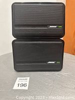 Front view showing two Bose 32SE speakers stacked