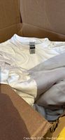 Gildan white t-shirts in cardboard box