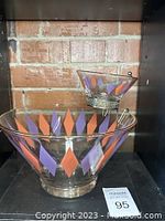 Photo of vintage chip and dip set showing large chip bowl and smaller dip bowl with metal holder, decorated with orange and purple diamonds.