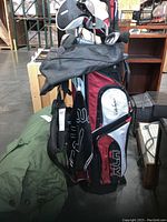 Photo showing full golf bag with clubs inside, Walter Hagen XLR branding visible.