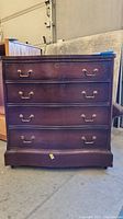 Front view showing 3-drawer Sheraton style chest with brass handles and scuffs.