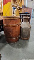Mini barrel and metal jug side by side showing size and condition