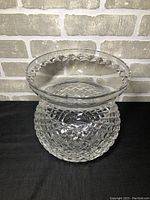 Front and top angle view of large Waterford crystal vase showing detailed diamond cut pattern and thick clear crystal with flared mouth.