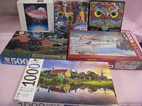 Photo showing a variety of puzzle boxes arranged against a white backdrop, highlighting puzzle count and box art.