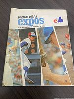 Front cover of the 1970 Montreal Expos souvenir yearbook, showing three vertical photo strips featuring baseball players and the Montreal Expos logo with blue and red text.
