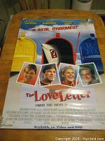 Full view of the movie poster showing cast members styled as postage stamps and mailboxes, with the movie title and tagline.